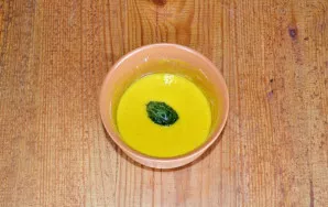 Dip each piece in the dough and place it in a pan with heated vegetable oil.