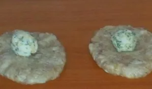 Put the filling in each minced meat pancake. Make a cutlet. Then dip in the dough.