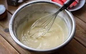 Stir everything vigorously with a whisk until a homogeneous, rather thick dough is obtained.