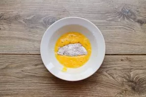 Break the egg into the bowl and stir until smooth with a fork. Dip each piece of chicken in the flour in the egg so that it is completely...