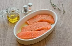 Smear the oven container with olive oil. Put pieces of fish in a pan. Salt and season with ground pepper. If desired, you can add a littl...