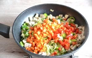 Add carrots and peppers cut into small cubes, boil a little.