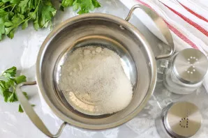 Pour salt and sugar into the pot.