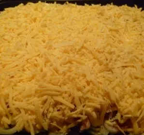 Finally, sprinkle generously with grated cheese.