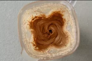 Continue grinding until the almonds begin to secrete the oil and turn into a thin paste. Periodically open the blender jar and scrape the...