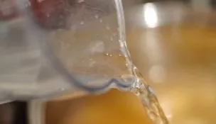 Pour water and broth into a saucepan. Put on the stove and bring everything to a boil. Cook the soup until the potatoes are tender, for a...