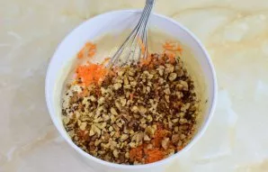 Then add cinnamon, orange zest, carrots and nuts.