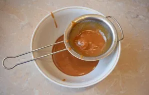 Then strain the caramel so that there is no undissolved sugar left.