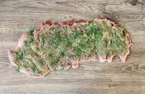 Sprinkle herbs on top of the mustard. We have a mix of parsley, dill and coriander.