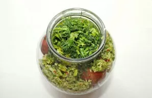 Finely chop the greens and put them in a jar.