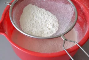 Add the sifted flour.