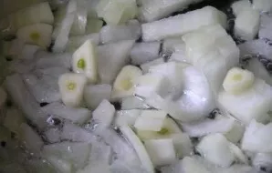 Peel and chop the onion and garlic. Fry the vegetables in oil until tender.