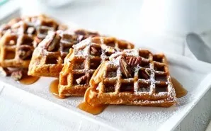 Pour the dough into the waffle and bake until golden brown. Serve with yogurt or syrup, decorate as desired.