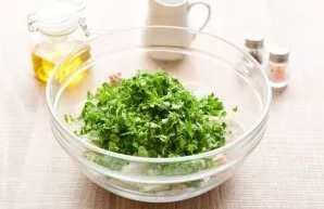 Finely chop the fresh parsley and add to the salad. Add salt and pepper to taste.