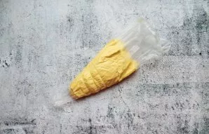 Put the dough in a bag and cut off the tip.