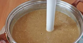 Cool the finished soup a little and grind with a blender until smooth. Then, if necessary, add water. Add a few nuts and serve.