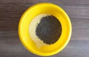 In another, add poppy seeds. We pour the dough into two molds with a diameter of 15-15. Bake in an oven preheated to 200 degrees for 15-2...