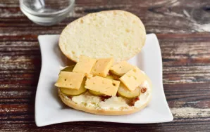 Then lay out the cheese, which is cut into thin slices or grated.