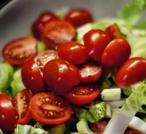 Add cherry tomatoes cut in half.