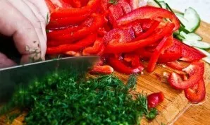 Wash, dry and chop a bunch of fresh herbs.
