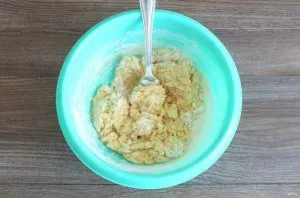 Start kneading the dough with a fork. As soon as the dough begins to form into balls, knead with your hands until smooth.