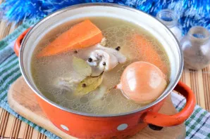 Then put peeled carrots and well-washed onions with husks in a saucepan. Husks will give the broth a beautiful shade. Cook the meat with ...