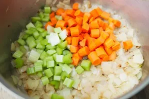 Add a little more oil to the pan, put chopped onions there first, and after a couple of minutes - celery and carrots. You can also use be...