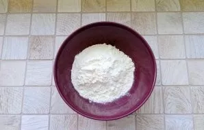 Add flour and baking powder to a separate bowl.