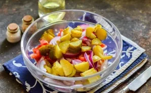 Cut the pickled cucumbers into small cubes or slices. Put cucumbers in salads.