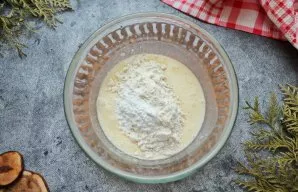 Mix flour with baking powder and sift into a milk mixture. Stir everything until smooth dough to the consistency of ordinary pancakes.