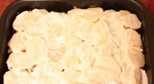 Grease the baking dish and add the ingredients in layers: 1) first lay out the onion rings; 2) on them - chicken fillet. Salt and pepper....