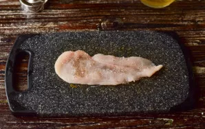 Salt and sprinkle with pepper each piece of meat on both sides.