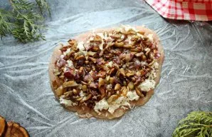 Spread the baked mushrooms and onions in an even layer on top of the cheese.