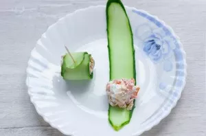 Put the filling on the cucumber and roll it into a roll. The tail of the cucumber should be on top so that you pin it with a bunch and do...