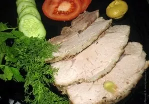 Cut the cooked pork into pieces and serve with herbs and vegetables. Delicious!