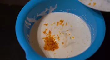 Add oil, orange juice to this mixture, add orange zest and vanilla sugar. Stir a little.