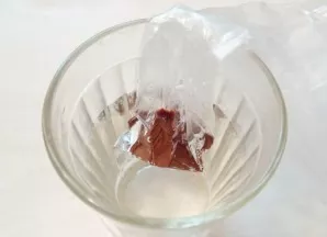 Break up the dark chocolate and put it in a bag. Heat the water until almost boiling and drop in the bag of chocolate. Keep it until the ...