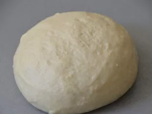 Knead the dough with your hands for at least 7 minutes until it becomes a smooth mass. She should not climb to the hands.