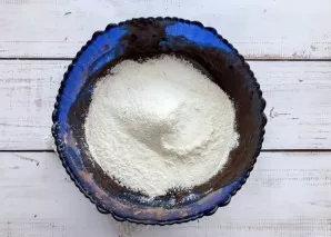 Add the sifted flour with baking powder and knead the dough. At the end, add vanilla sugar.