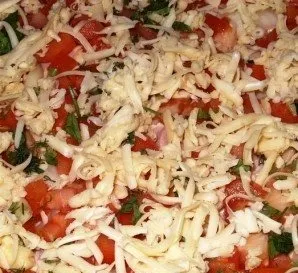 We put it in the oven, heated to 200 degrees, and bake the pizza until it is soft - about 10-15 minutes.