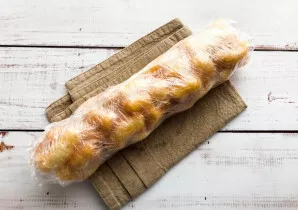 Give shape by wrapping in a film and pressing with your hands from all sides. Put in the refrigerator for 2 hours.