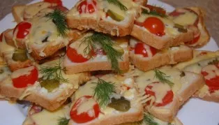 We bake our sandwiches in the oven at a temperature of 180 degrees for about 10 minutes. Before serving, you can garnish with herbs such ...