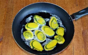 Fry the cucumbers over medium heat on both sides until golden brown.