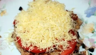 Then sprinkle the pork with finely grated cheese and place in an oven preheated to 180-190 degrees for about 20-30 minutes. Decorate the ...