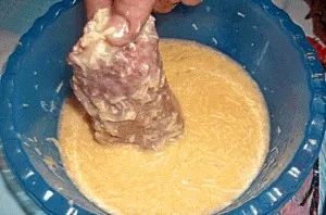 Then put each piece in the cheese-egg mixture, and also roll it on all sides.