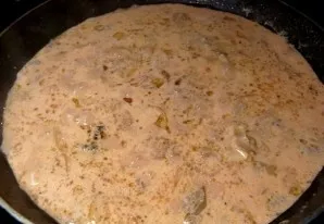 Now pour the prepared sauce into the pan, cover with a lid and simmer the meat over low heat for half an hour, during this time the pork ...