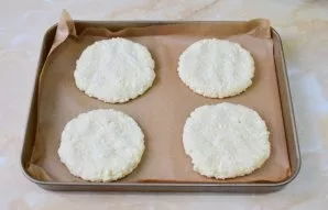 Line the baking sheet with baking paper. Moisten your hands or lubricate them with vegetable oil. Form pancakes and put them on a baking ...