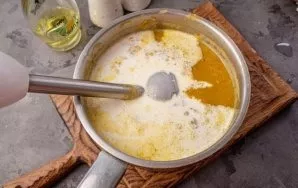 Add salt, pepper and pour in the cream. Put on the stove and bring the soup to a boil. Adjust the amount of cream to the desired consiste...