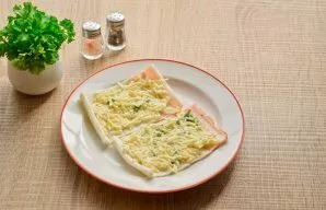 Unwrap the crab sticks and coat with the prepared cheese mixture.