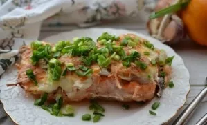 Place the fish for 15 minutes in an oven preheated at 200 C, and then 2-3 minutes under the grill until browned.